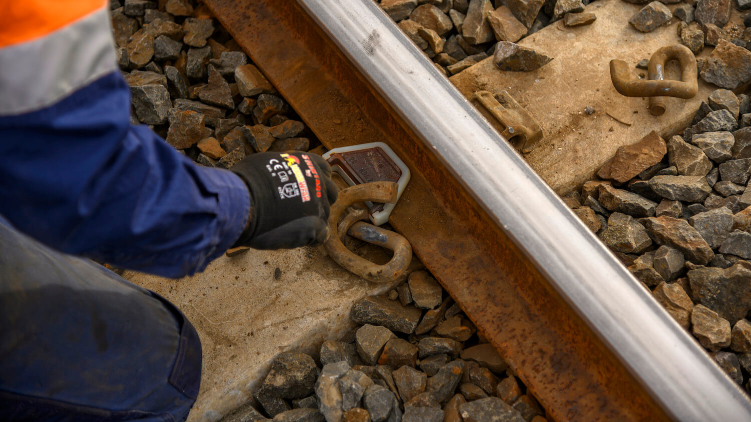 Close up of engineer's hands on track