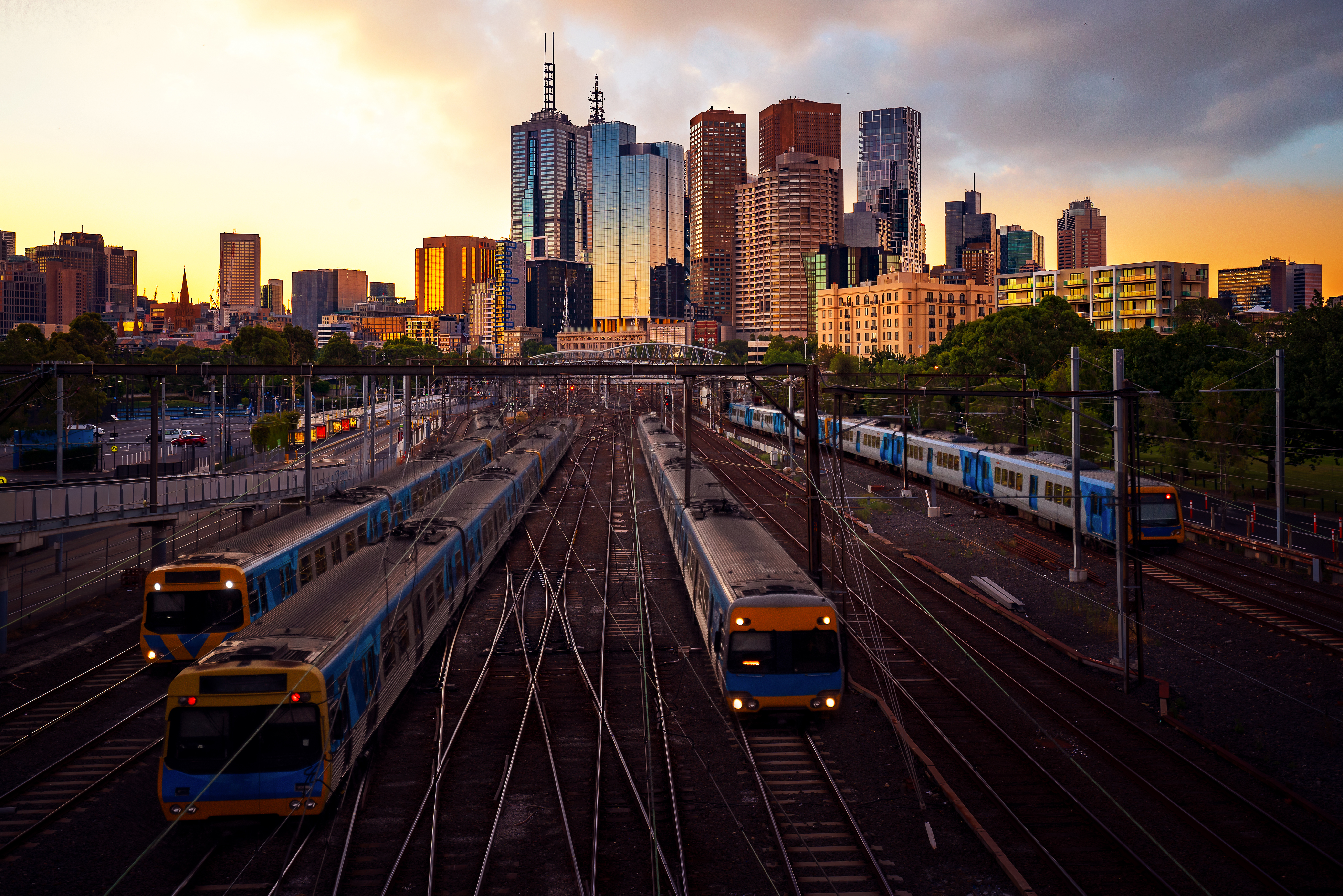 Rail yards with city background at sunset